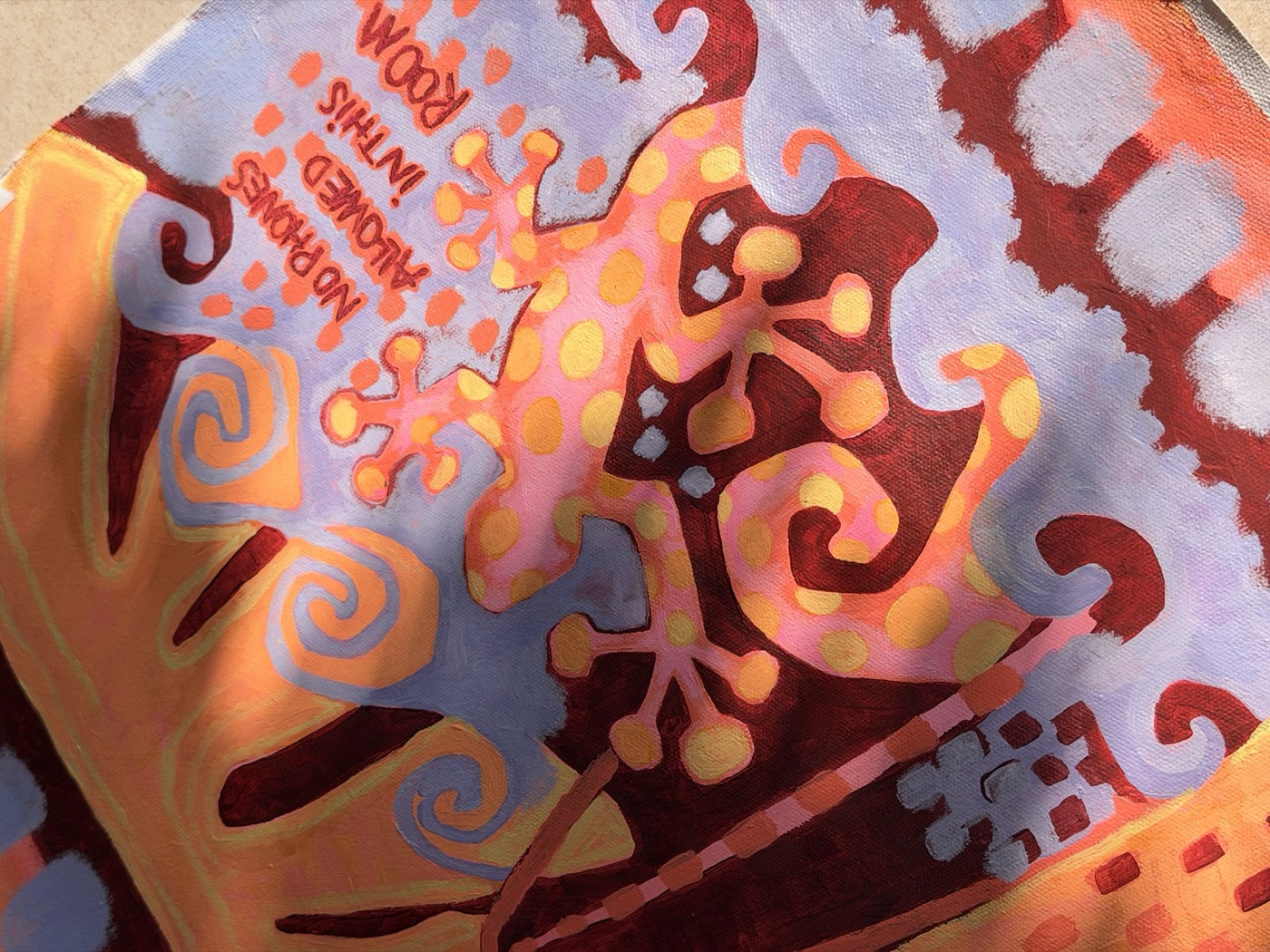 Detail of the gecko painting with lettering and swirling lilac clouds