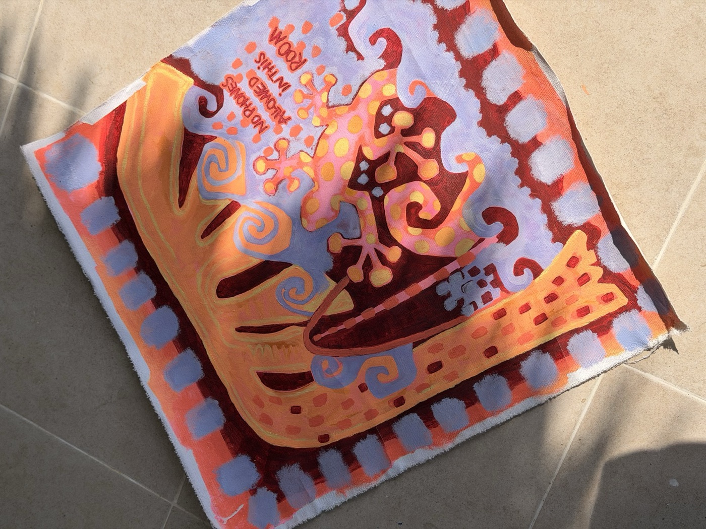 Painting of a pink spotted gecko on an orange palm with the words 'No phones allowed in this room', framed by lilac squares